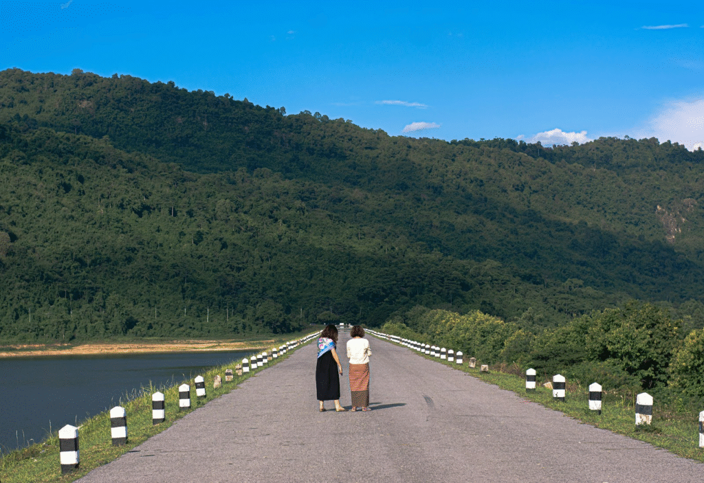 Tourists enjoying a scenic view of Kasauli with travel essentials